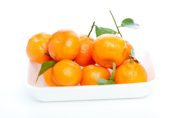 Tangerines with leaves isolated over white