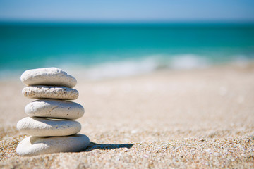 Stack of white stones on tropical beach