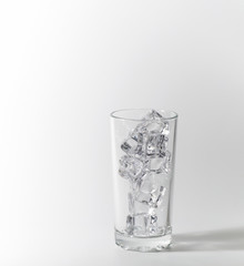 Glass with ice cubes.