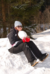 Girl with a snowball in the hands