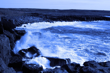 wave crashing on burren cliffs