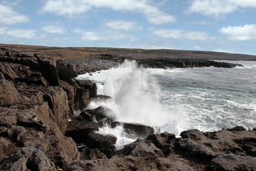 wave crashing on coastline cliffs