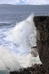 waves crashing on cliffs