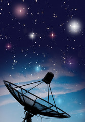 Satellite dish under starry night sky