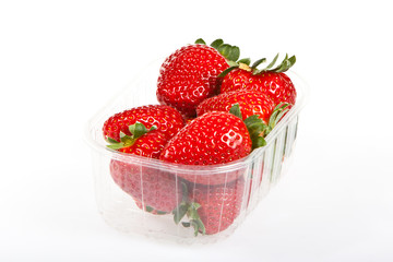 Fresh strawberries in a punnet isolated on white.