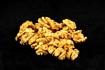 Wallnuts shelled from Chile on black background