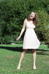 Portrait of the young beautiful smiling woman outdoors