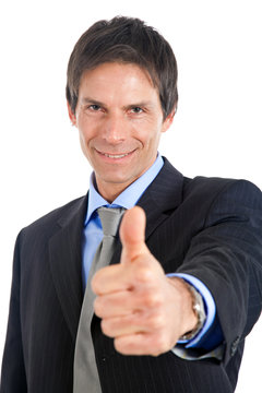 Mature businessman making all right gesture