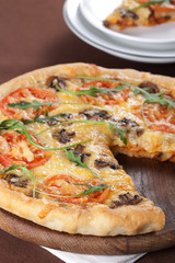 Pizza with mushroom and tomatoes