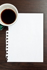 Coffee and blank paper