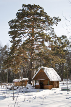 Cabin in snow in forest