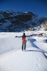 greeting hiking woman on snow