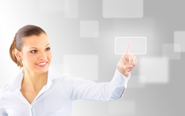 Attractive brunette with interface in futuristic interior