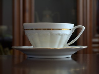 The china cup of coffee on table