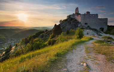 Ruin of castle with sun