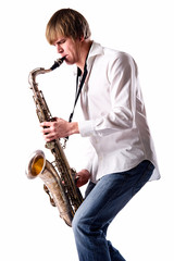 Young man playing the saxophone over white background