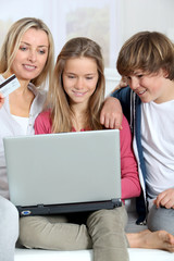 Mother and children at home doing online shopping