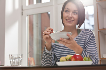 young woman having breakfast