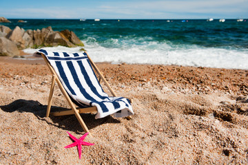 Fototapeta na wymiar Empty chair at the beach
