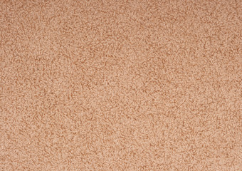 Texture beige fleecy carpet. Can be used as a background.