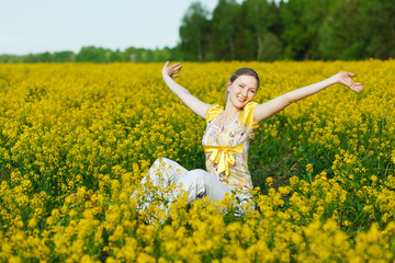Naklejka na ściany i meble happy woman on yellow field