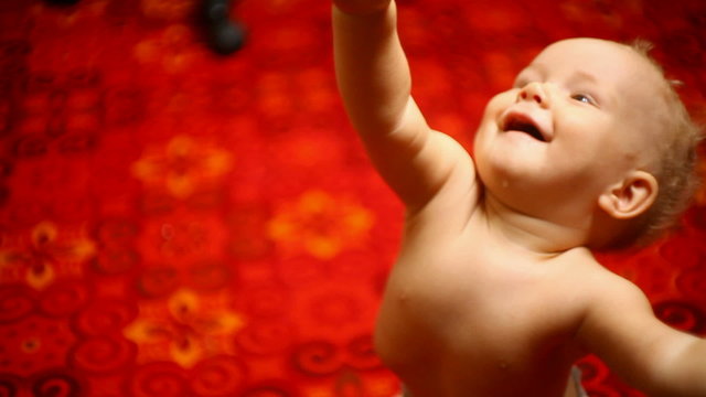 small child reaches for her mother