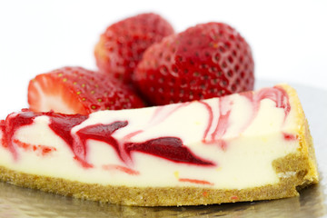 A Cheesecake Slice Garnished with Strawberries