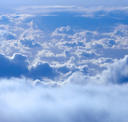 On top of fluffy curvy clouds