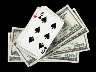 Deck of cards and money on black background