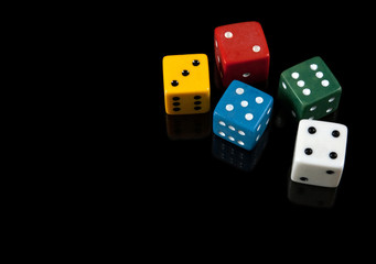 Colorful dices on black background