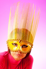 Attractive woman posing in the stylish mask