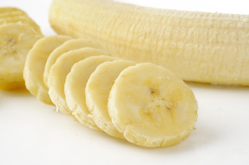 sliced bananas on a white background