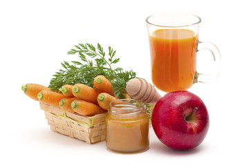glass of fresh carrots juice with apple and honey