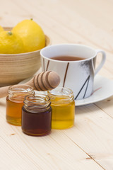 cup of tea, honey and fresh lemons