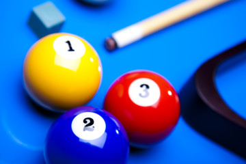 Billiard balls isolated on blue