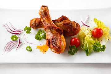 Roasted chicken drumsticks and vegetables