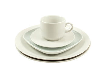 pile of plates and  cup isolated on white