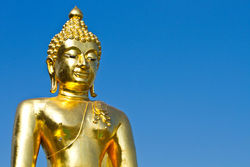Fototapeta na wymiar Golden Buddha under the open sky
