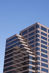 Office Tower of Brown and Black Glass on Blue Sky