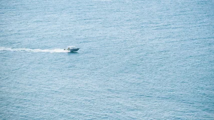 Fotobehang Motor boat in the sea © Tim