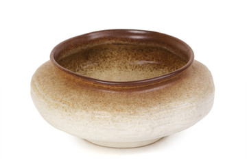 low and wide brown flowerpot, view from above, isolated