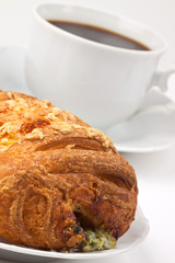 Breakfast: coffee and bun with cheese and spinach