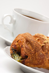 Breakfast: coffee and bun with cheese and spinach