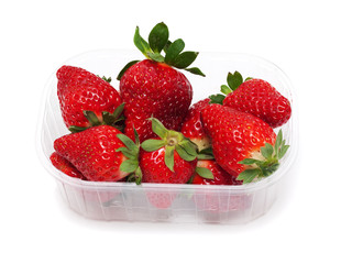 Ripe strawberries in  plastic container