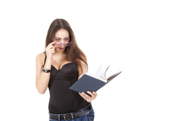 Surprised pretty girl with book, pen and glasses