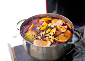 Casserole with hot wine, fruits and spices