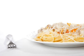Spaghetti with meat and carrrot on dish isolated on white, cropp