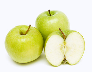 two and a half green apples isolated