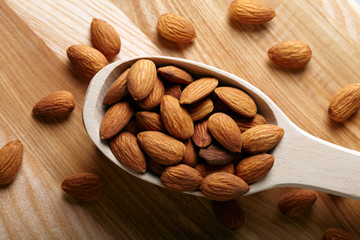 Almonds on wooden background