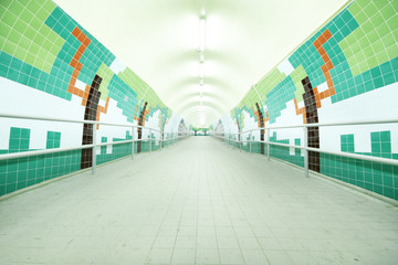 long tunnel with lamps and nobody walking
